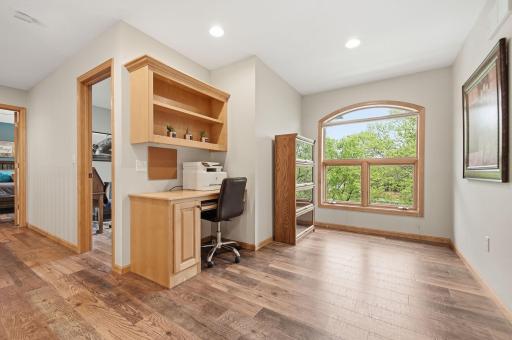 The upper-level loft offers versatile space for a home office, playroom, craft area, or anything your heart desires.