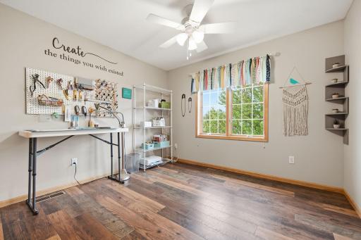One of the four upper-level bedrooms has been converted into a craft room but could easily be used as a bedroom, office, hobby space, or whatever best suits your needs. All the rooms are spacious