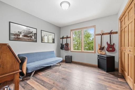 The third of the four upper-level bedrooms is currently being used as a music room.