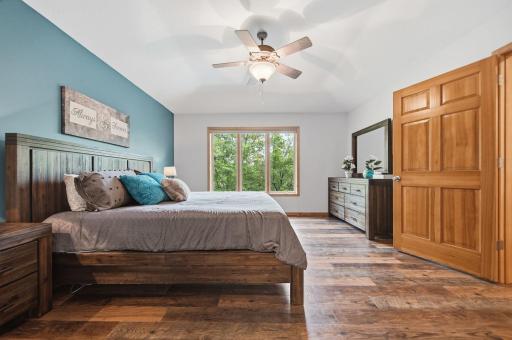 The upper-level primary bedroom is generously sized, features a spacious ensuite, and overlooks the backyard.
