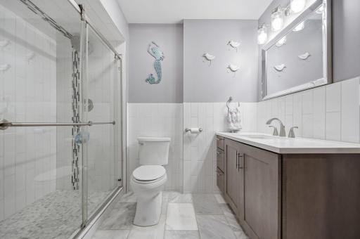 The lower-level 3/4 bath is perfect for guests staying in the lower-level bedroom, as well as for entertaining party guests.