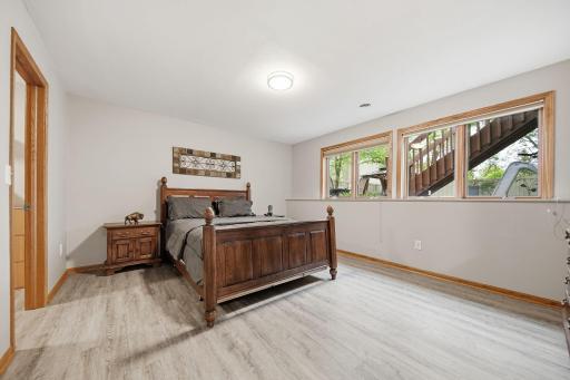 The lower-level bedroom features a large connected walk-in closet, offering excellent storage and convenience for guests or extended stays.