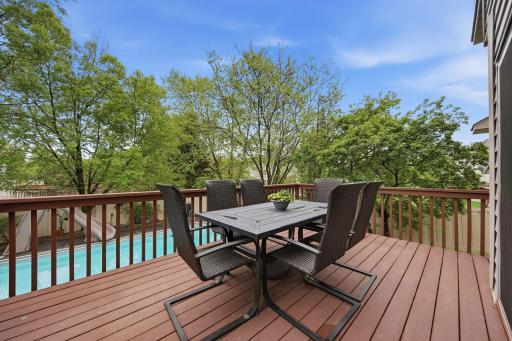 A deck just steps from the kitchen and informal dining area provides the perfect space to entertain friends and family.