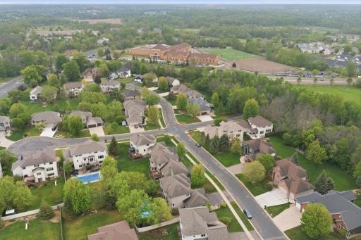 An aerial view showcasing just how close the property is to Maple Grove High School.