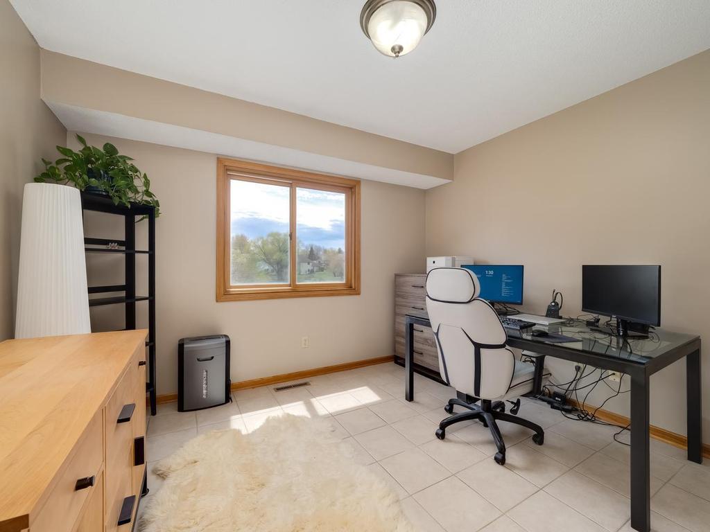 guest bedroom upper level overlooking the backyard ceramic flooring