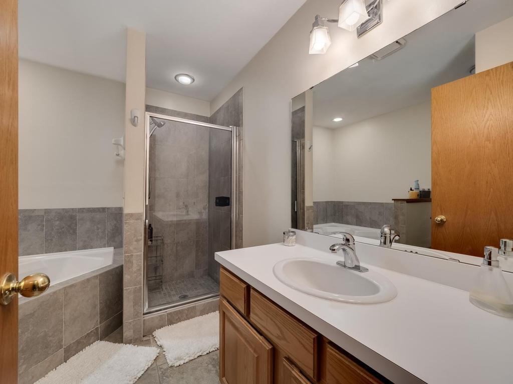 Primary walk-thru bath ceramic surround standing shower