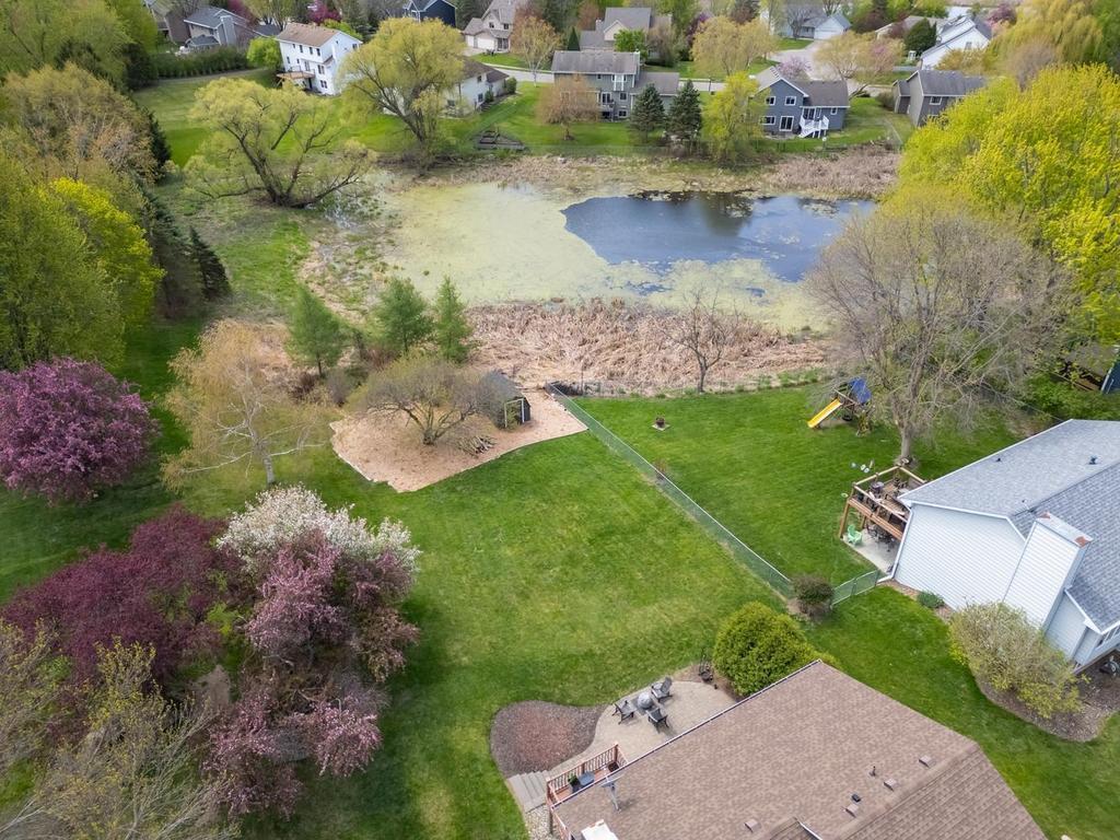 Aerial shot showing the half acre lot with your own storage shed