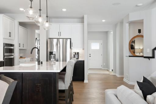 Front entry is wide and opens to great room