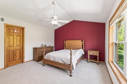 Upper level primary suite with vaulted ceilings