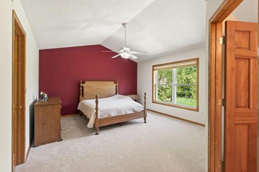 Upper level primary suite with vaulted ceilings