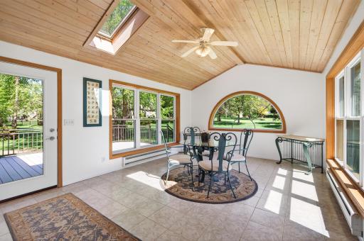 Three season sun room overlooking spacious backyard