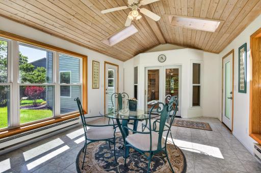 Three season sun room overlooking spacious backyard