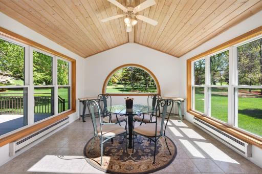 Three season sun room overlooking spacious backyard