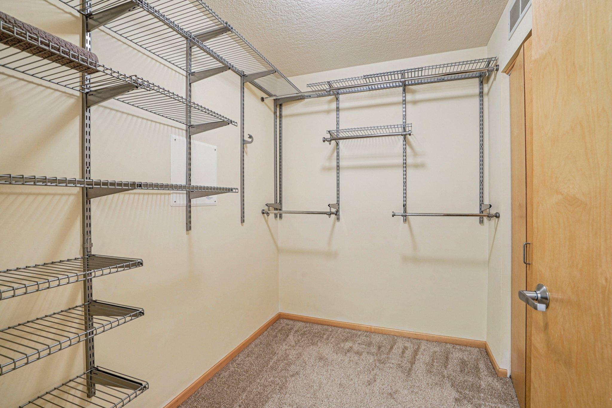 Walk-in closet includes organizers