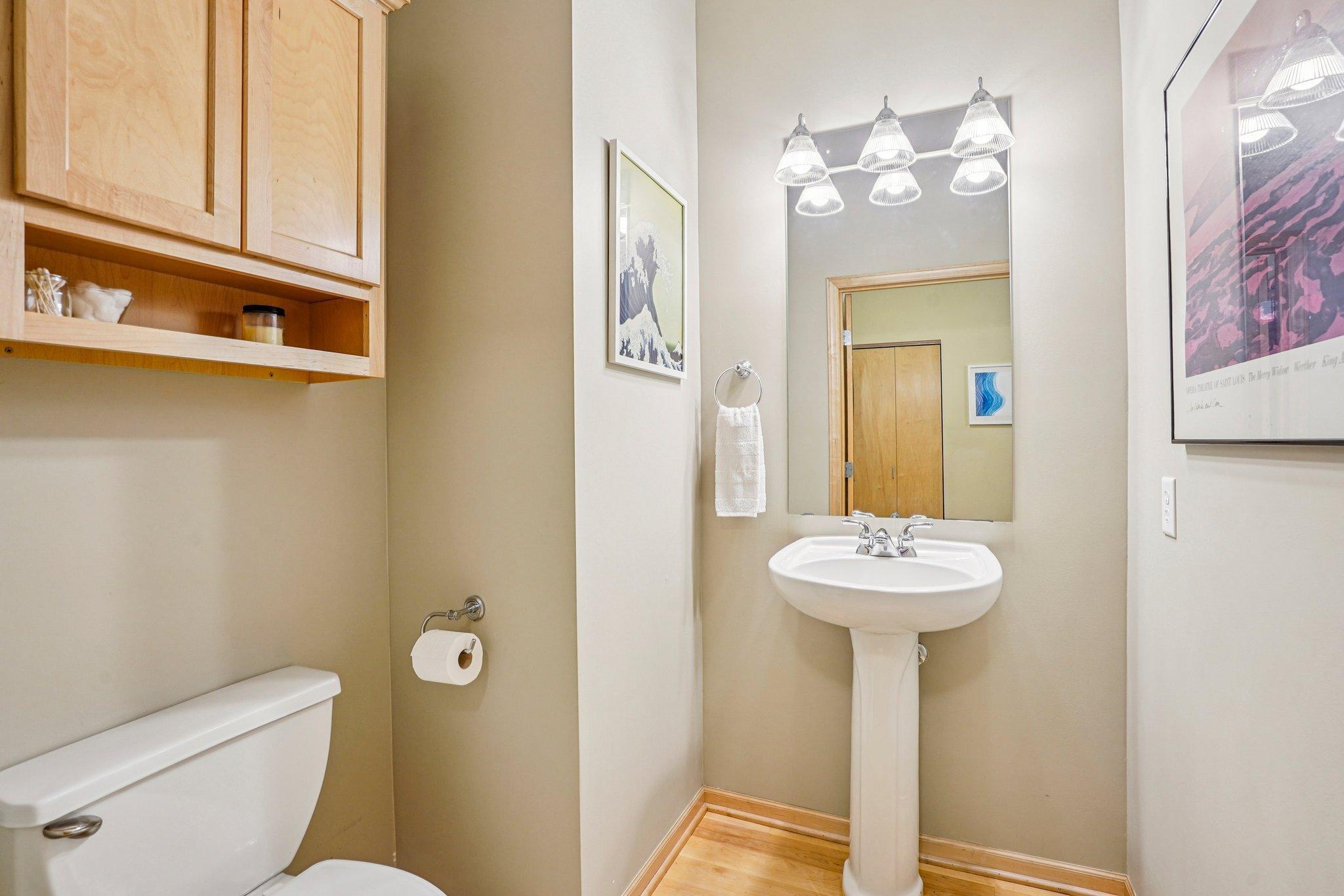 Bathroom #2, a 1/2 bath between the kitchen and the building hallway