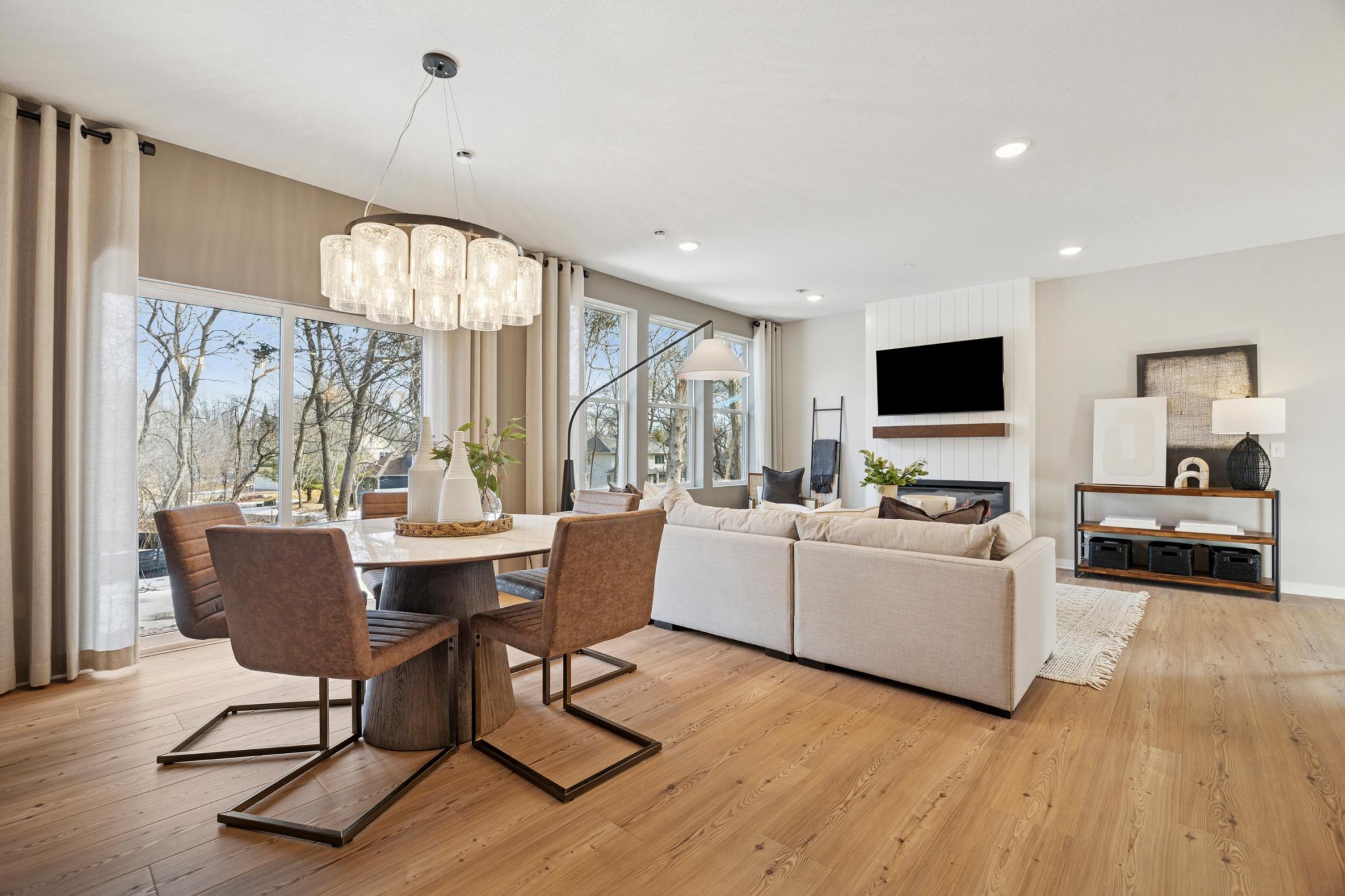 Perfectly appointed dinette area seamlessly blends into the open floorplan, ideal for casual meals, a morning coffee spot or additional seating when entertaining. Pulte - 9301 Larimar Trail_Photos are of the model home. Finishes may vary.