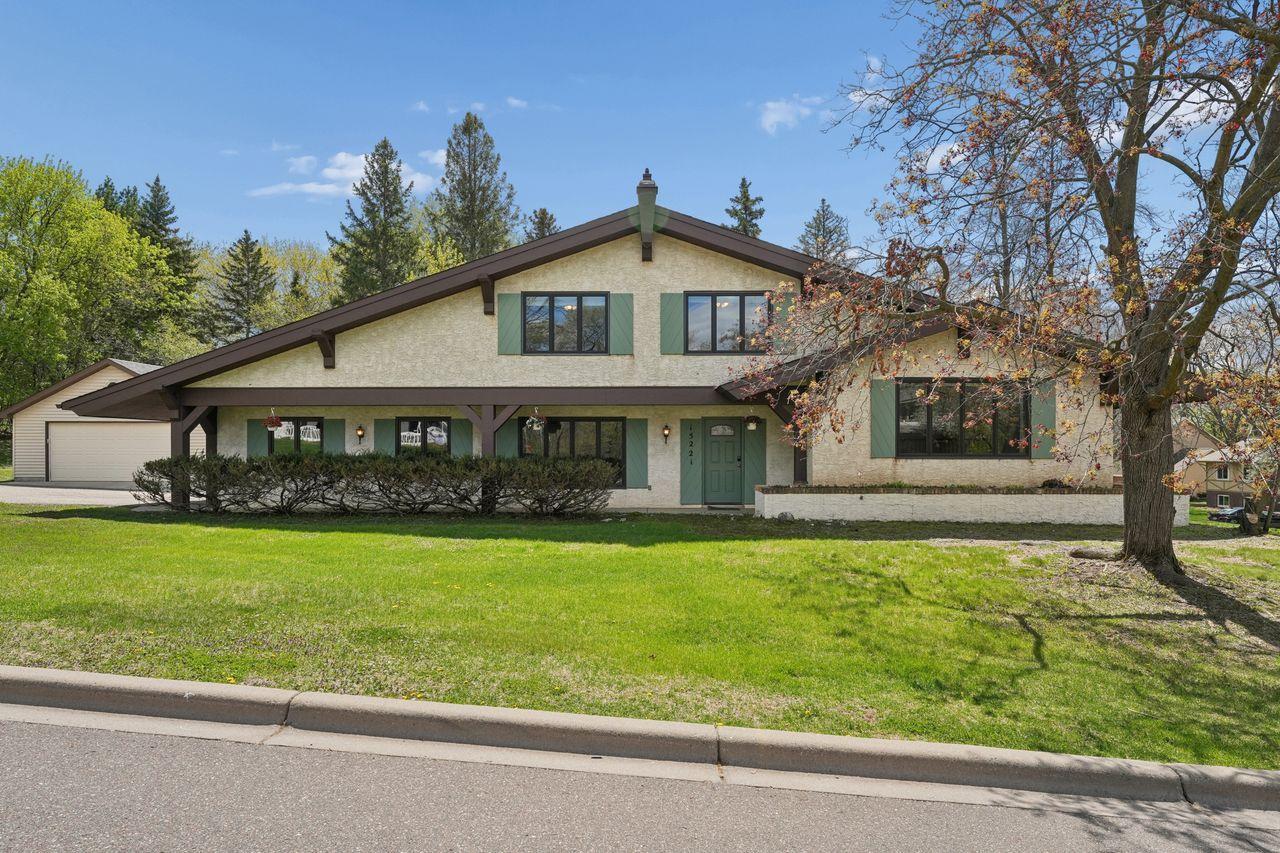 Primary front photo, spacious .5 acre lot, maintenance free stucco siding, new roof, nicely landscaped, 2 car attached garage & 2 car detached garage.