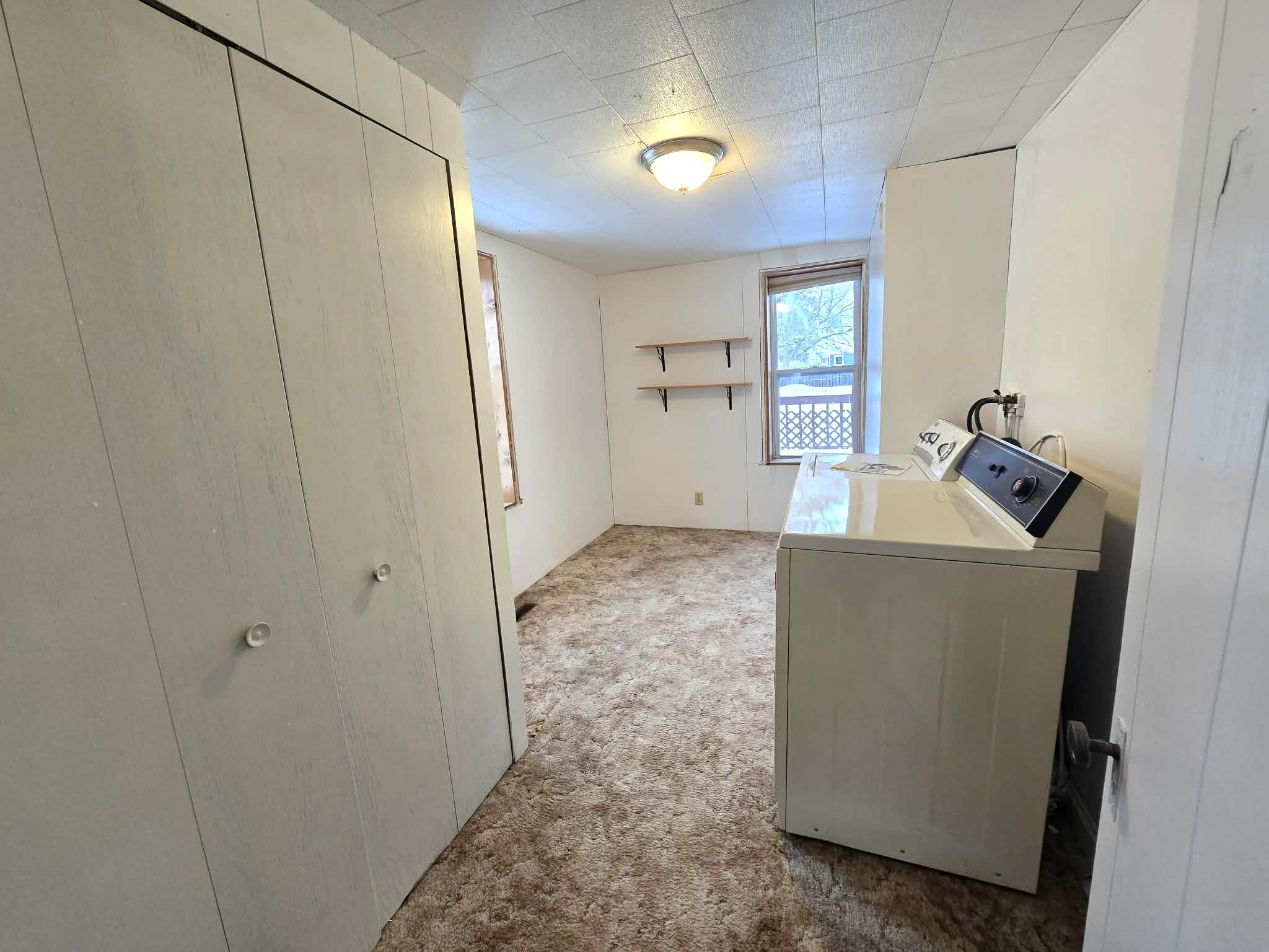 Flex Room, currently used as laundry room on main level.jpg
