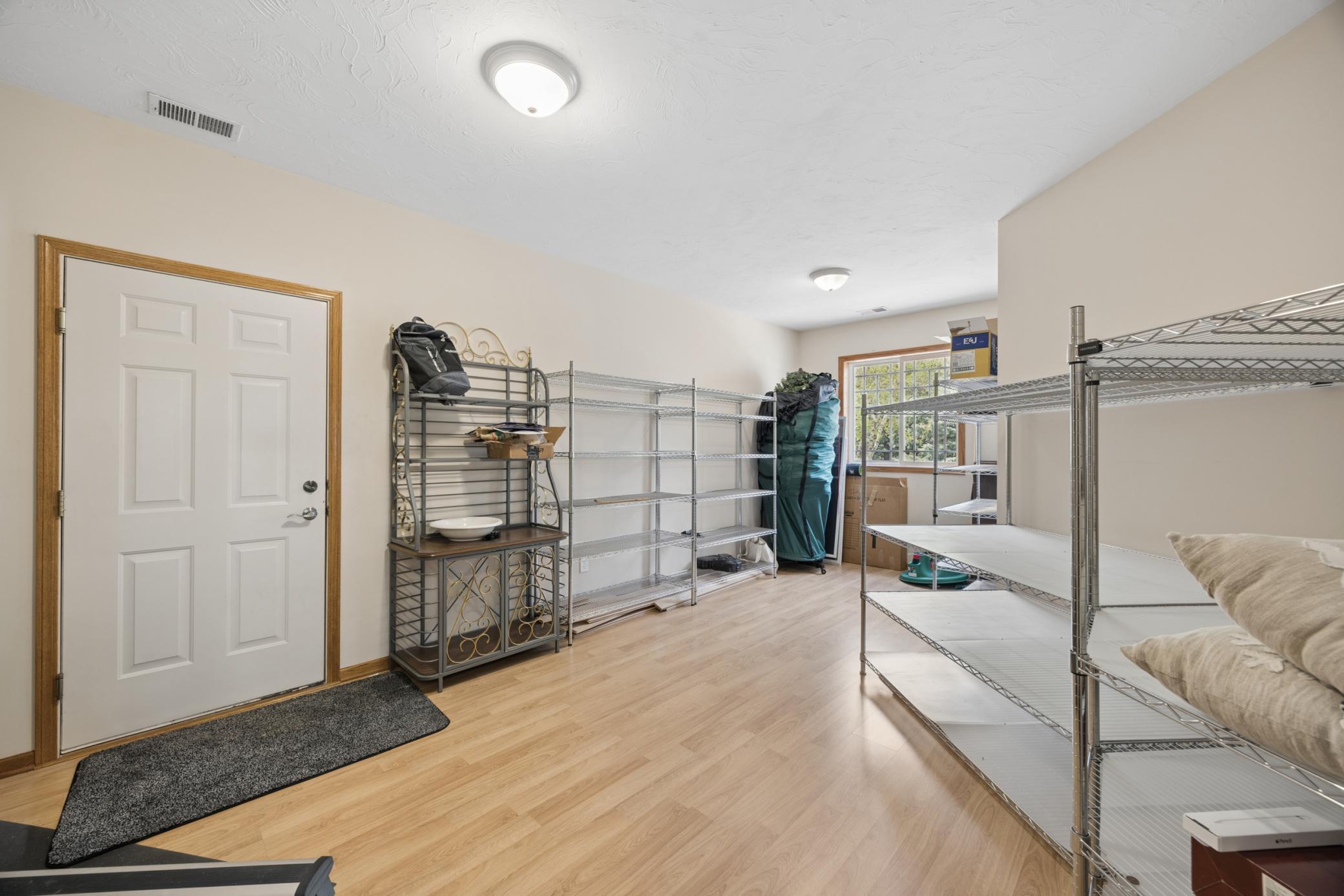 Large Spancrete garage entry/mudroom offering great space and convenience.