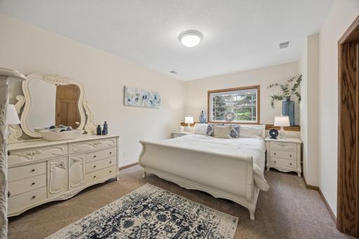 Lower level fourth bedroom featuring abundant natural light.