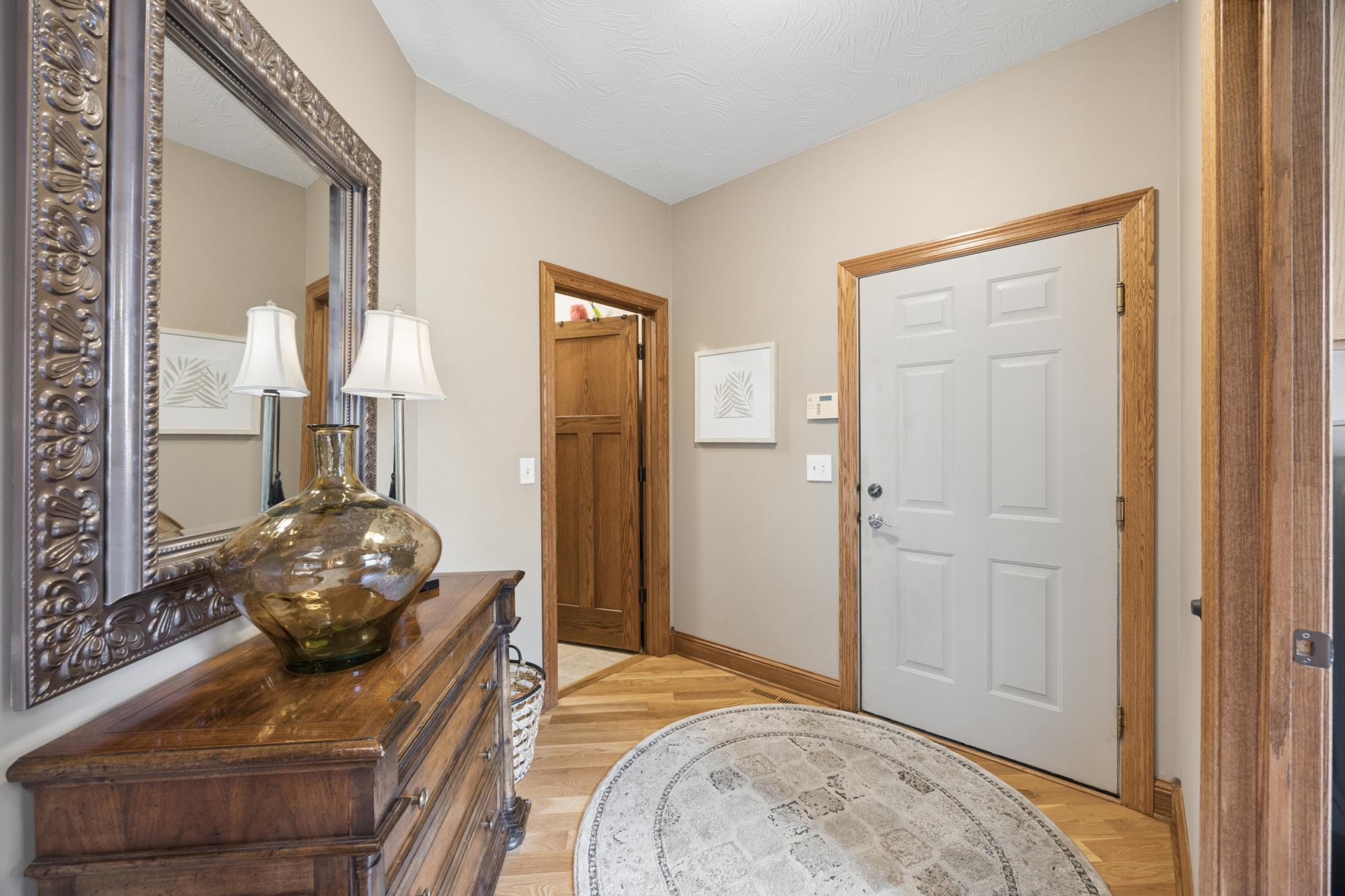 Generous garage entry complemented by an expansive mudroom, thoughtfully positioned for everyday convenience and storage.