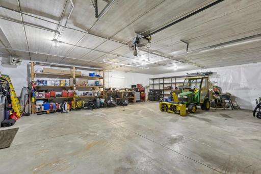 Lower-Level Garage with Overhead and Service Door.