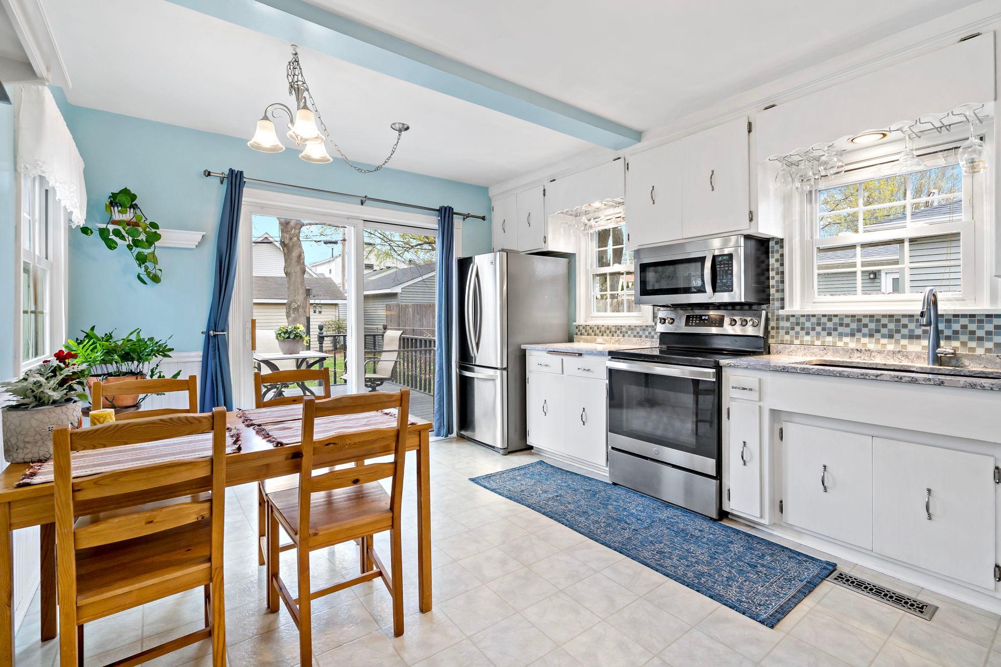 The kitchen is HUGE! View towards the back deck.