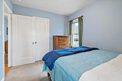 Bedroom two features updated midcentury corner windows and a big closet.