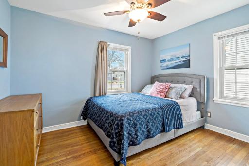 Bedroom one features updated midcentury corner windows and a big closet.
