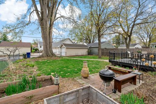 Raised garden beds, patio, deck, and fully fenced yard... you are ready for summer!