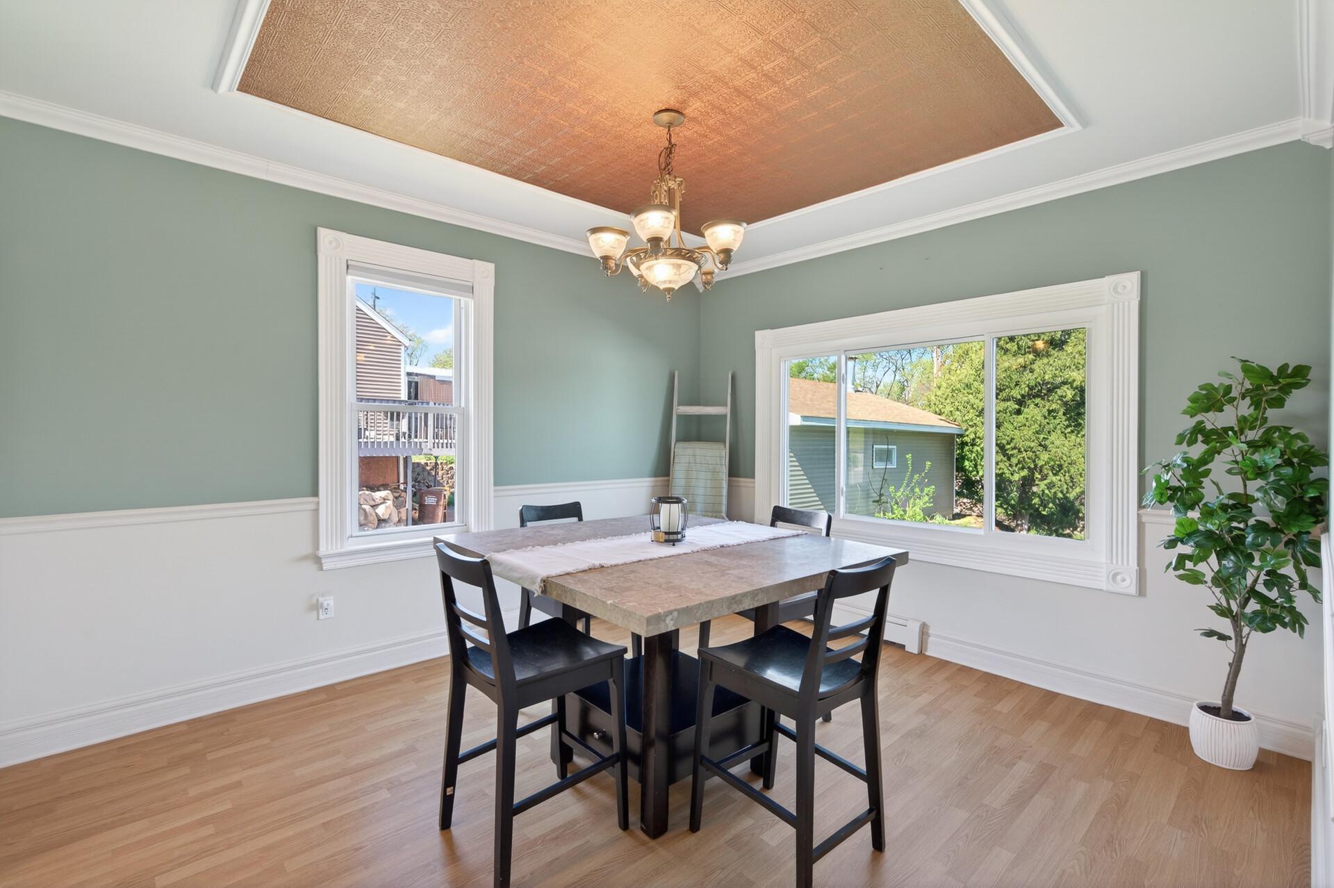Dining room with large window looking out to backyard