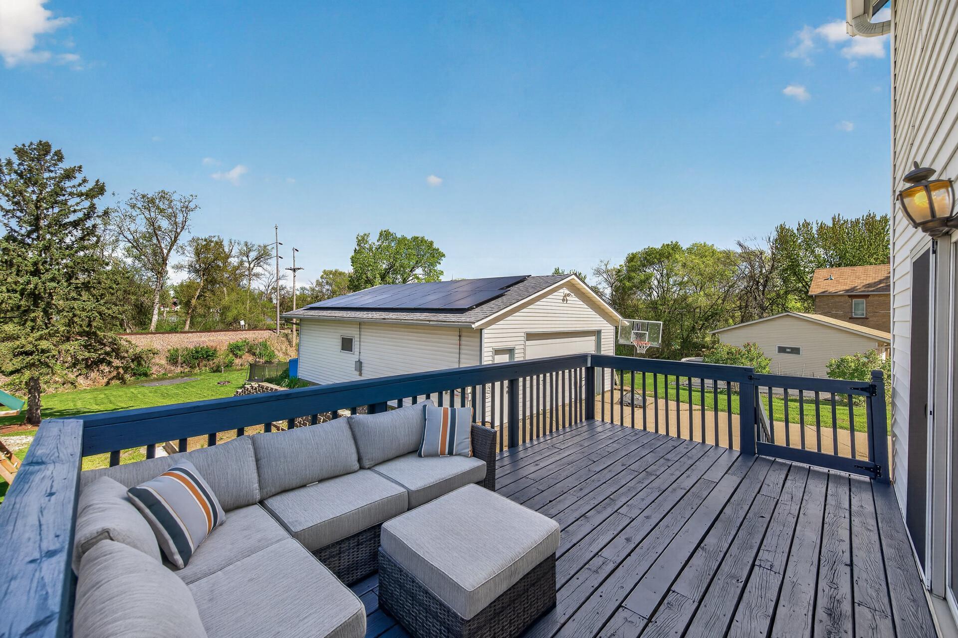 Deck off back of the house overlooking backyard