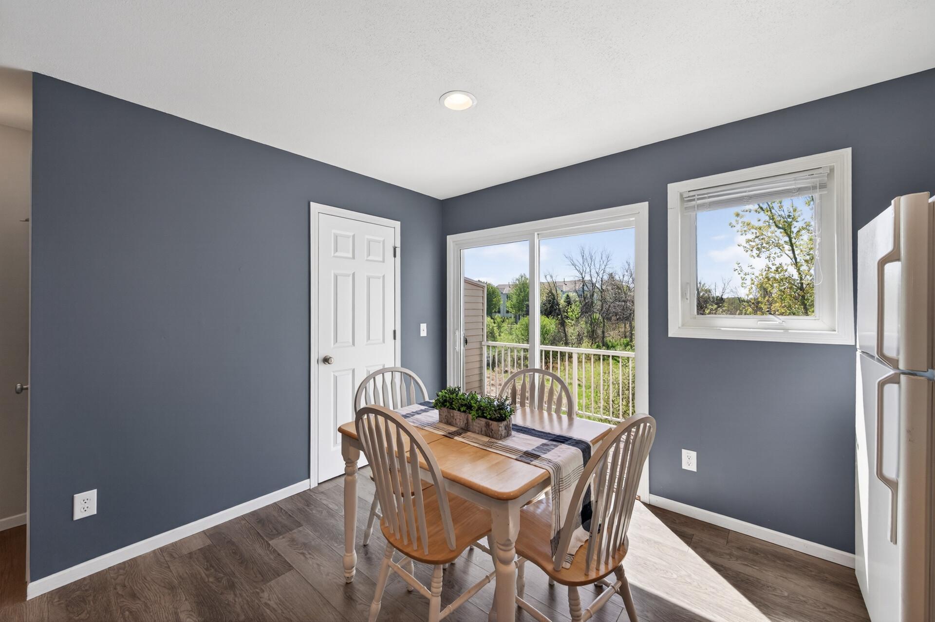 Kitchen has great natural light and leads out to deck