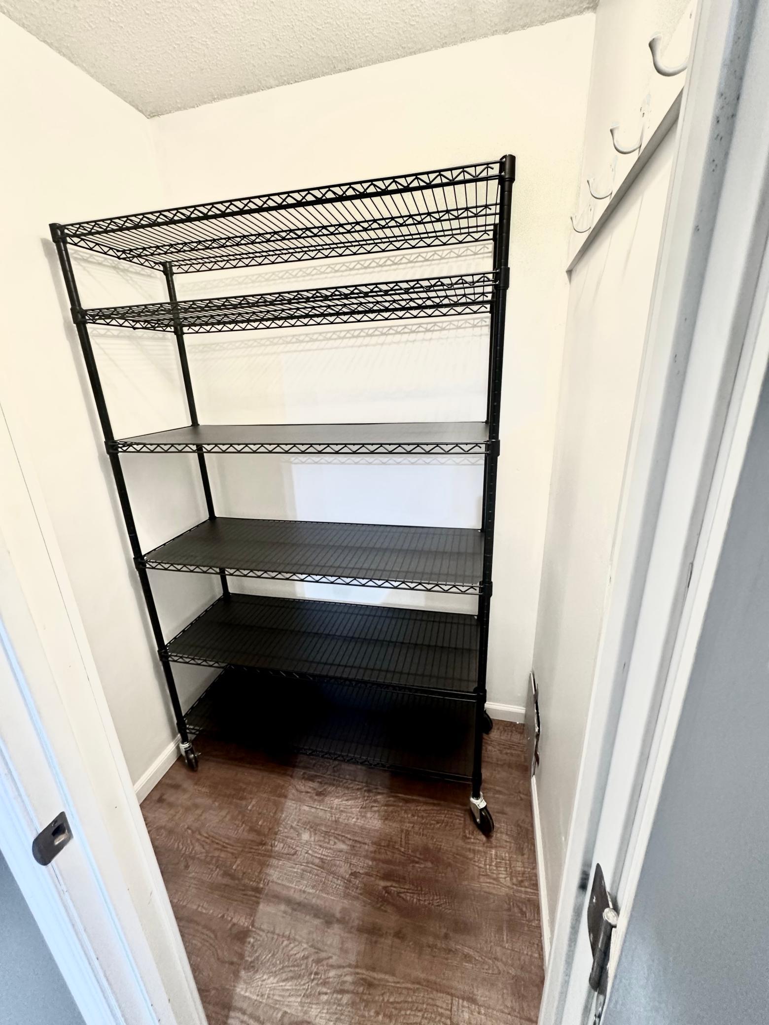 Spacious Hall Closet with Moveable Storage Shelt