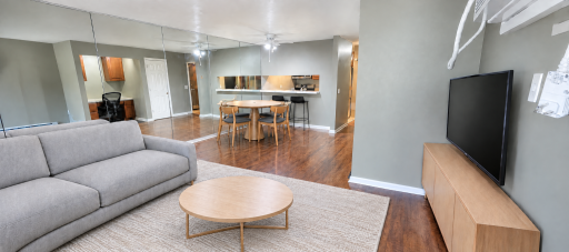 Living room and dining with pass through to kitchen (virtually staged furniture)