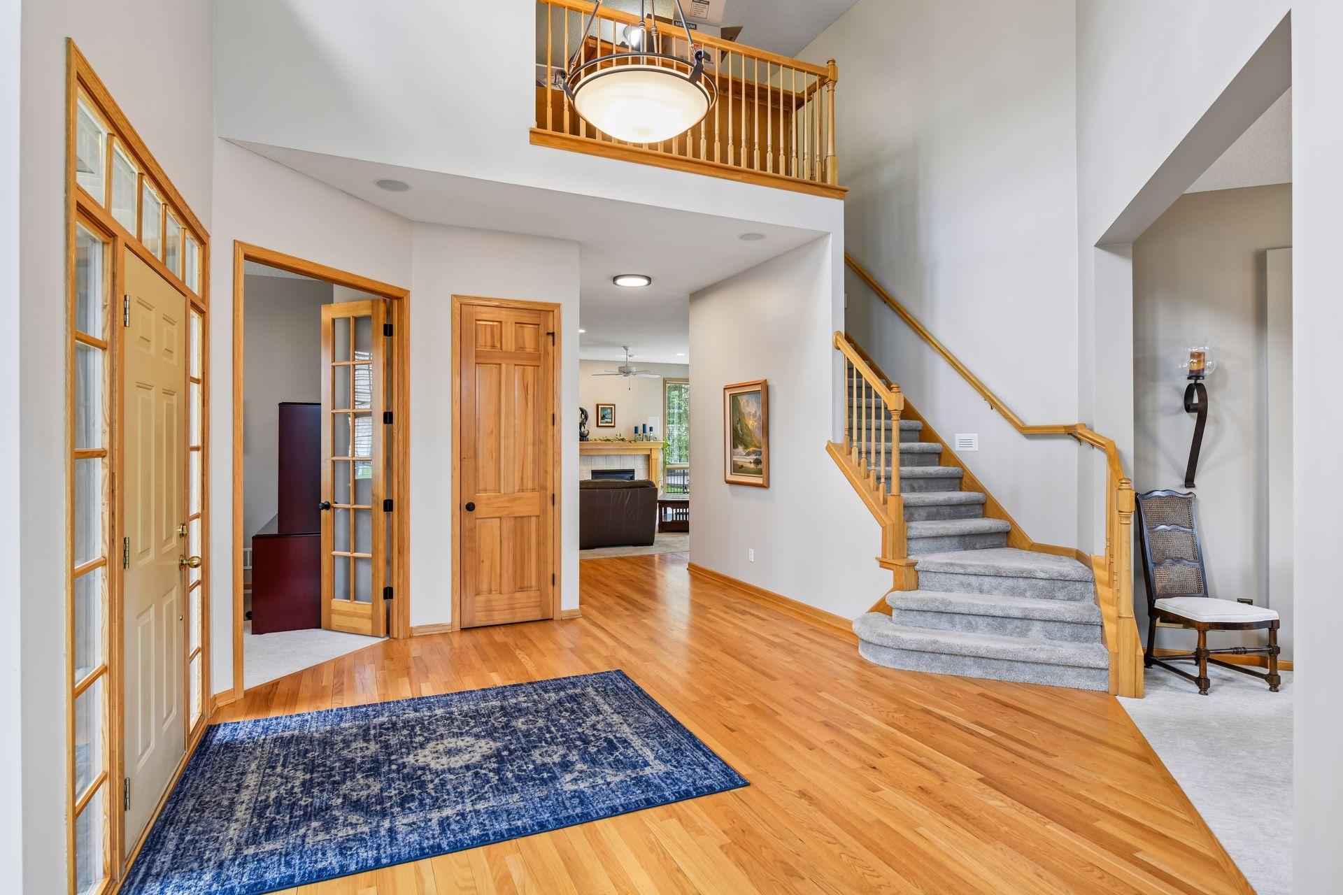 Upon entry, a grand staircase immediately welcomes you, creating a striking first impression.