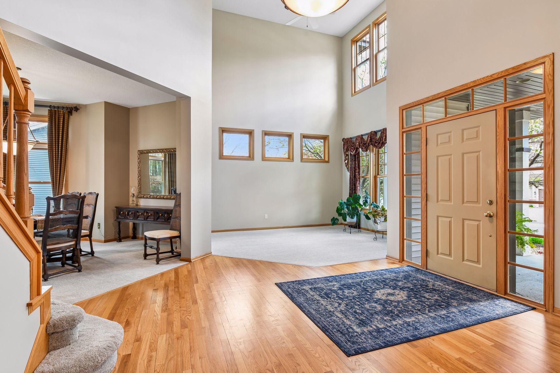 Vaulted ceilings extend into the main-level living room, creating a light-filled and airy feel throughout.