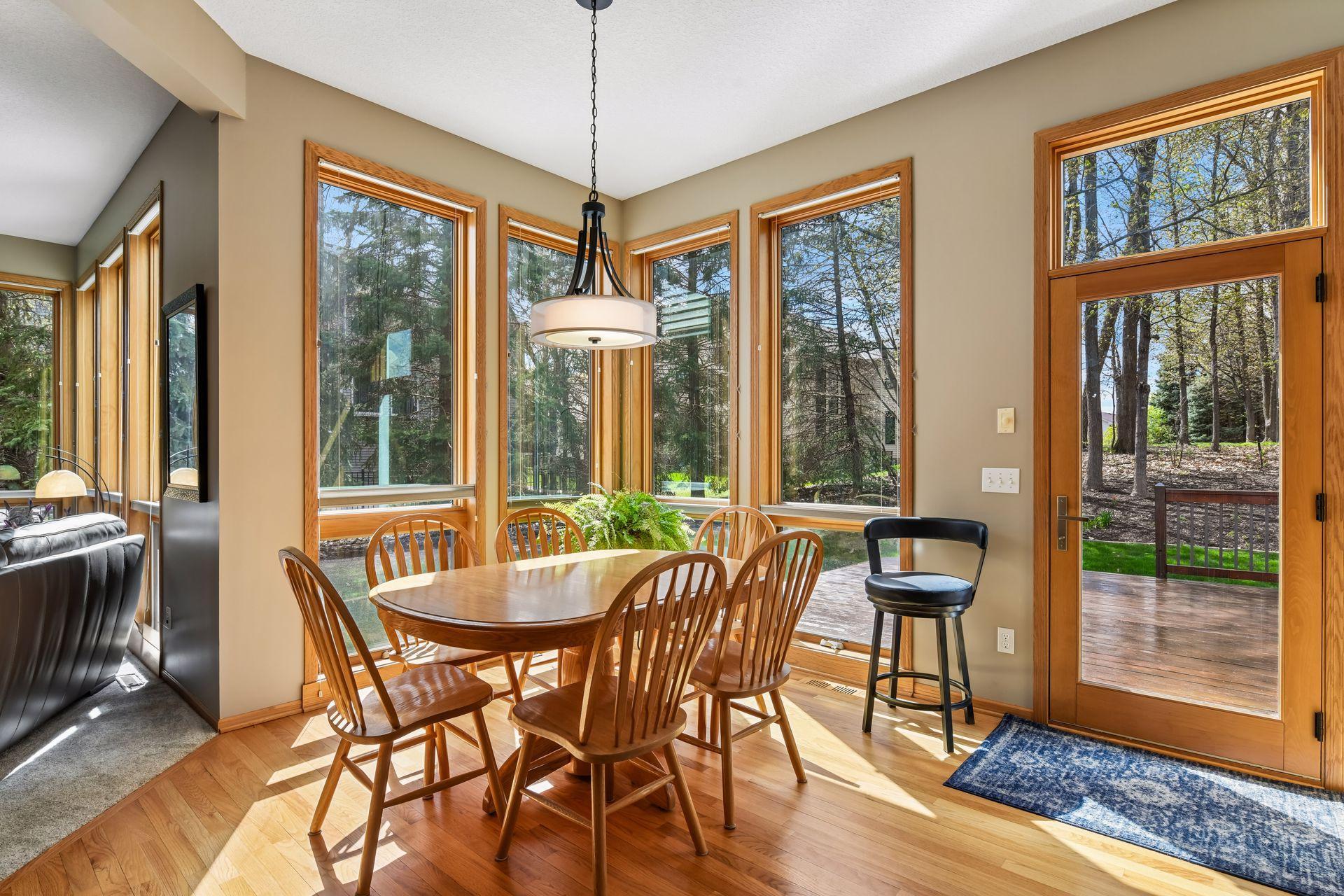 The dining room and family room both feature stunning floor-to-ceiling windows—one of the home’s standout features.