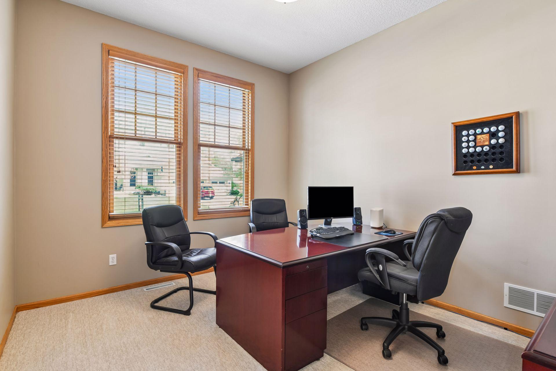 The main-level office features glass French doors.