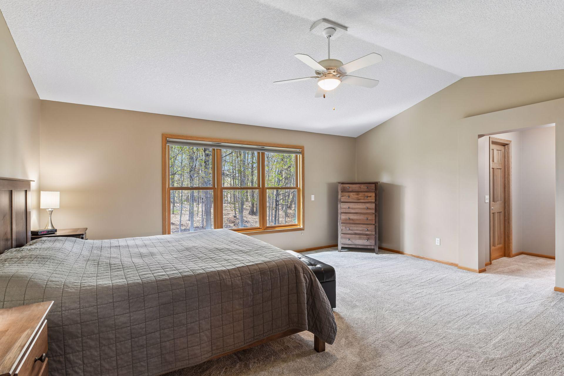 The primary bedroom features two walk-in closets conveniently located just outside the bathroom.