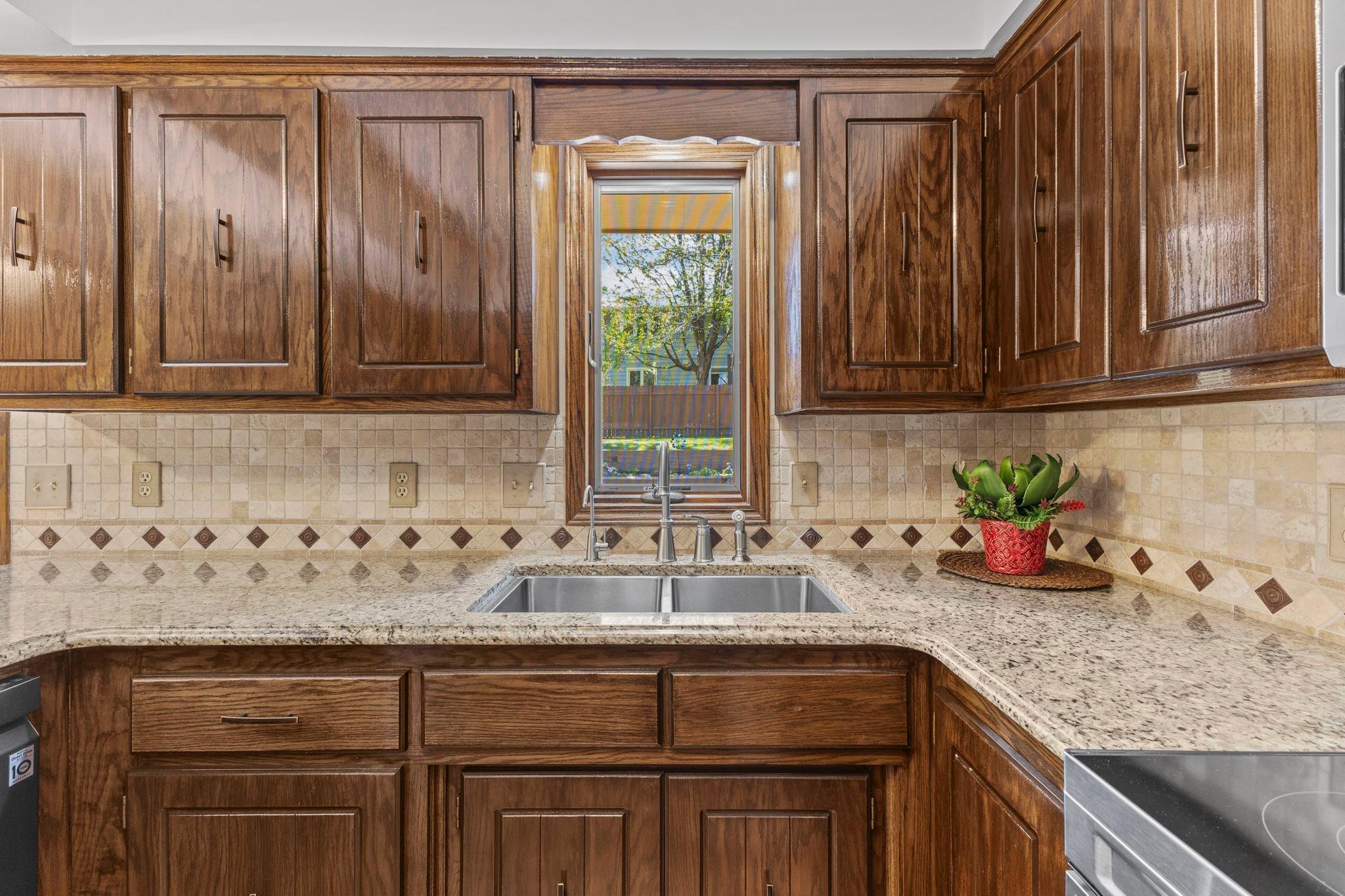 Along with a kitchen window with beautiful views of your stunning backyard!