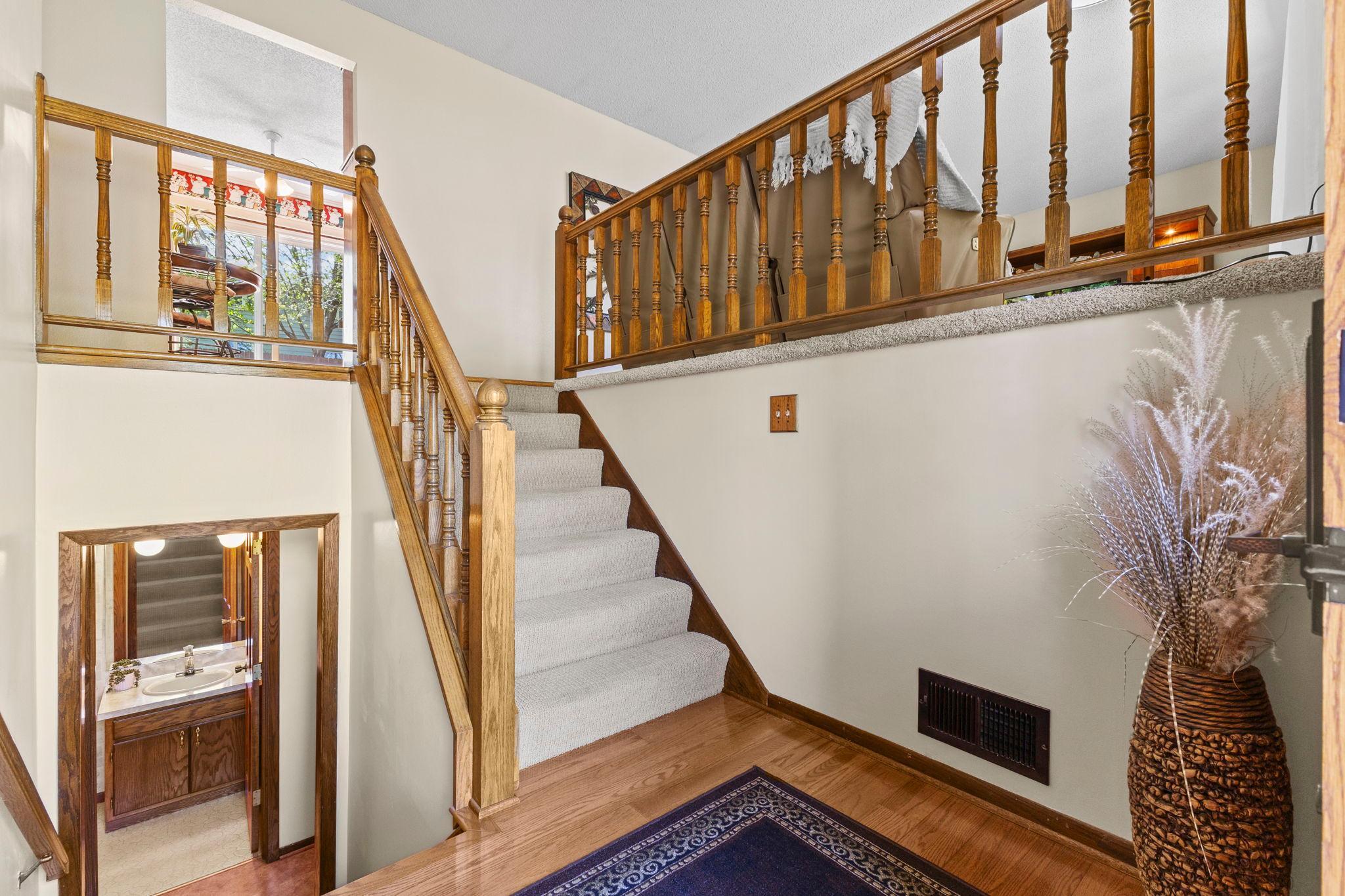 Welcoming you is a large foyer with tall ceilings and beautiful oak hardwood floors!