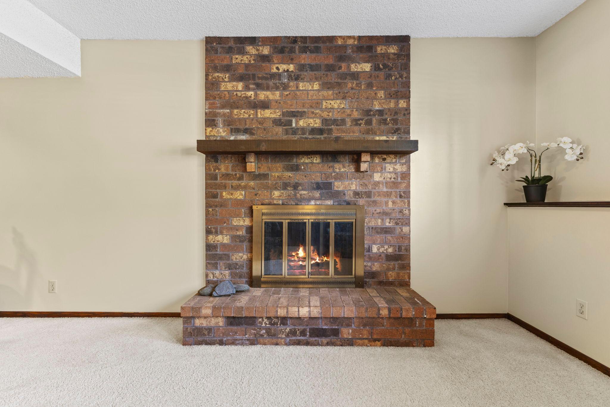 And a gorgeous brick, wood-burning fireplace.
