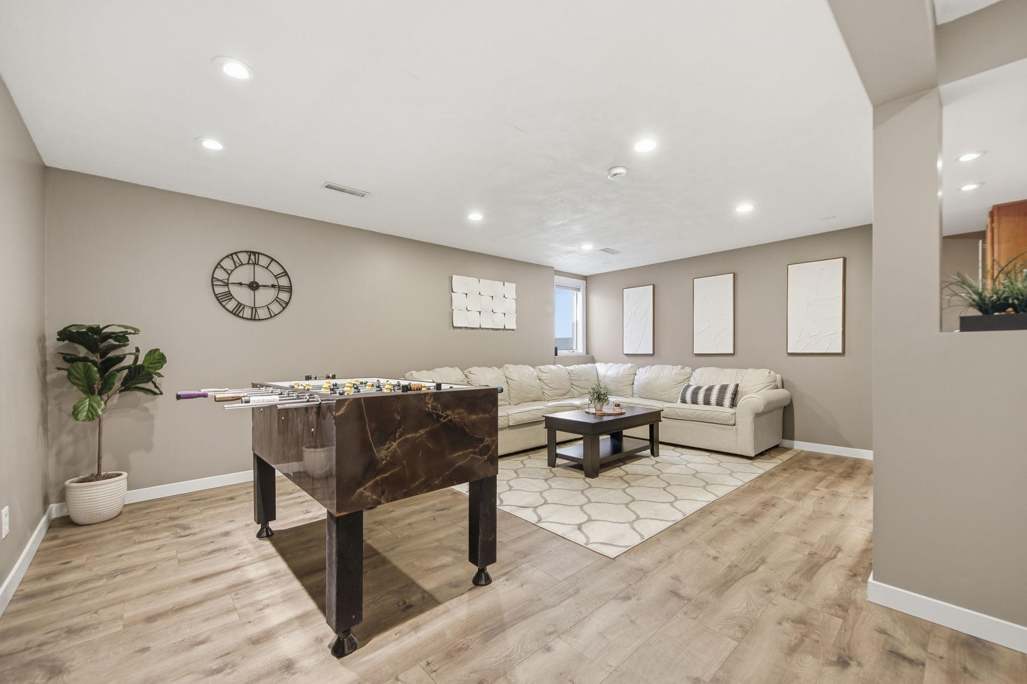 Meander downstairs to a fully finished lower level featuring built-ins and an electric fireplace