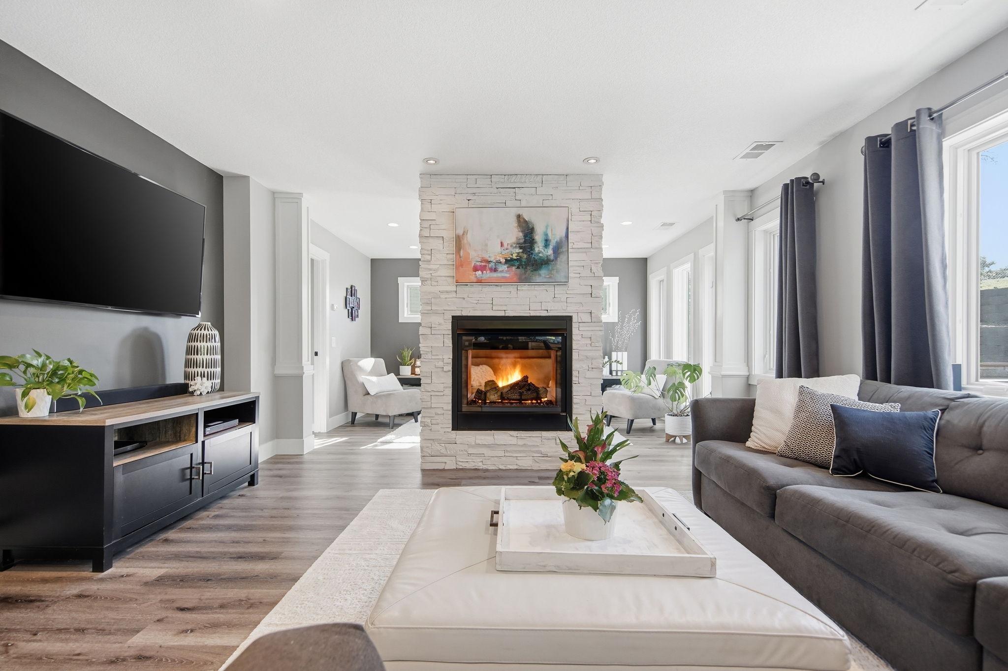 Lovely family room featuring a two-sided fireplace