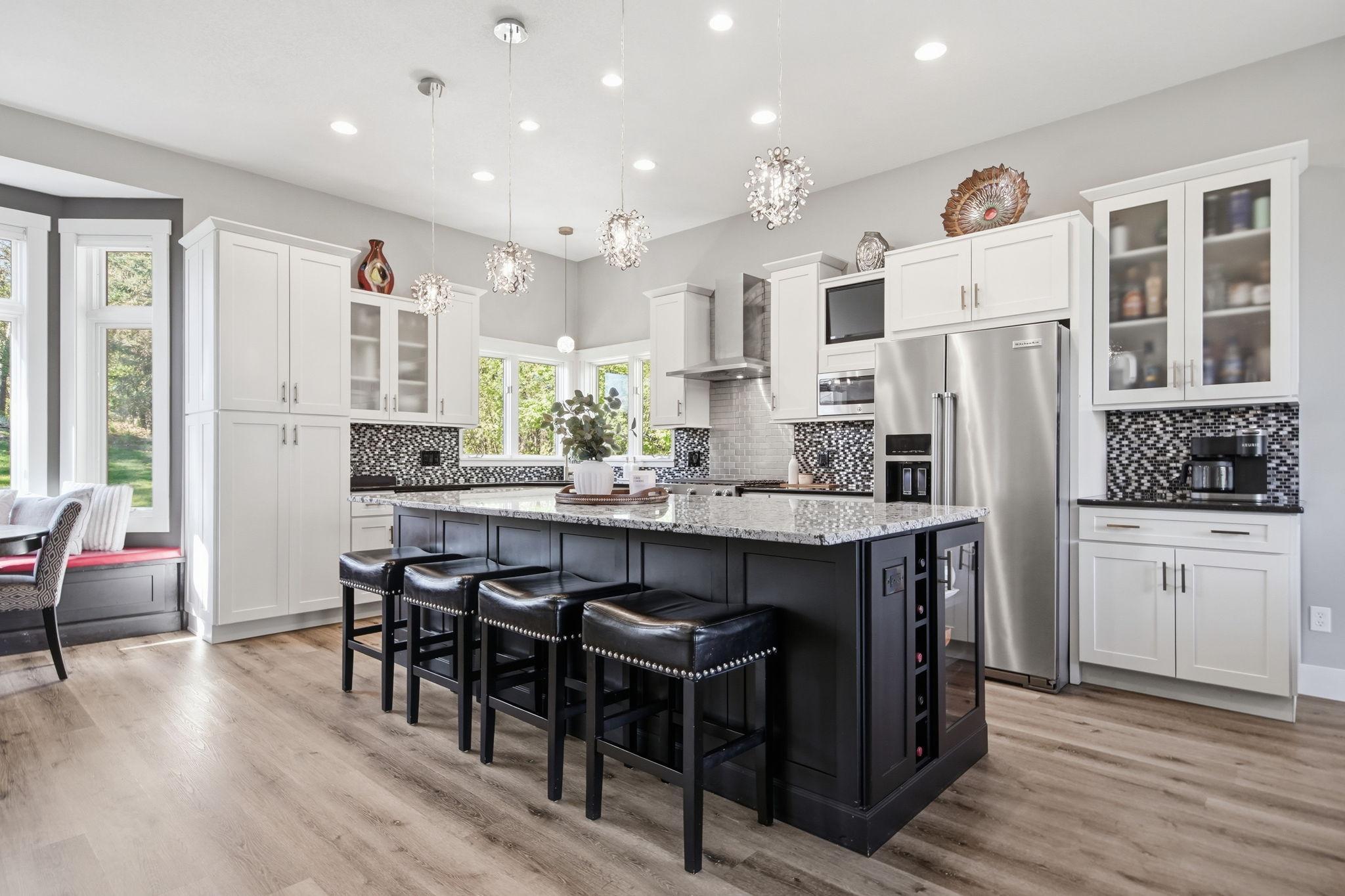 This magnificent island has more than ample seating with a beverage cooler