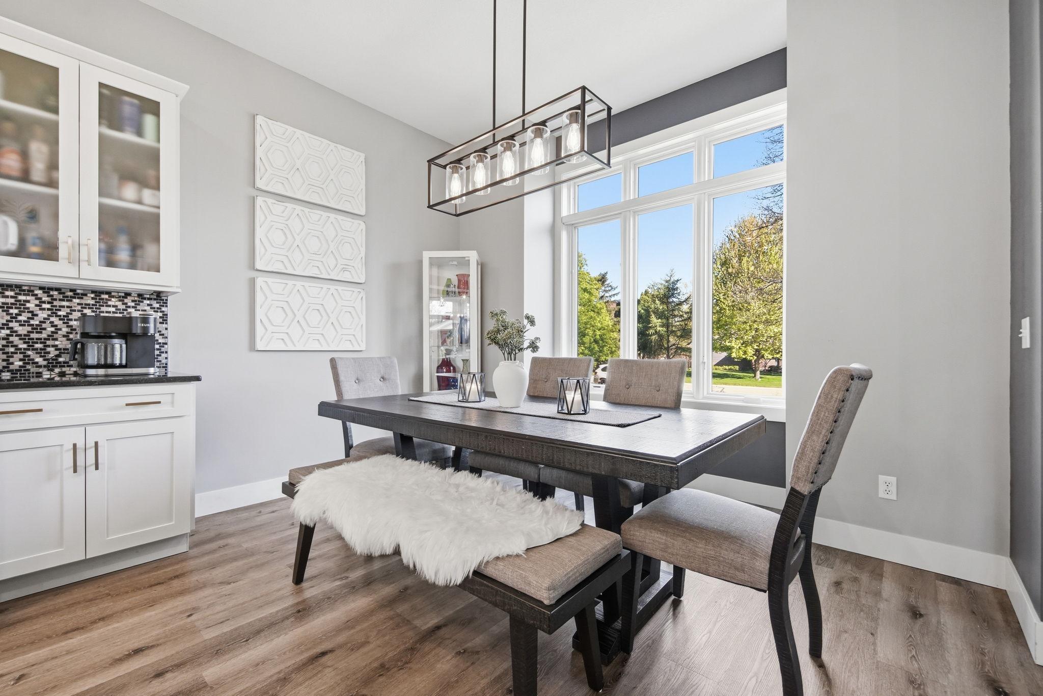 Enjoy the stately picture window with elegant lighting