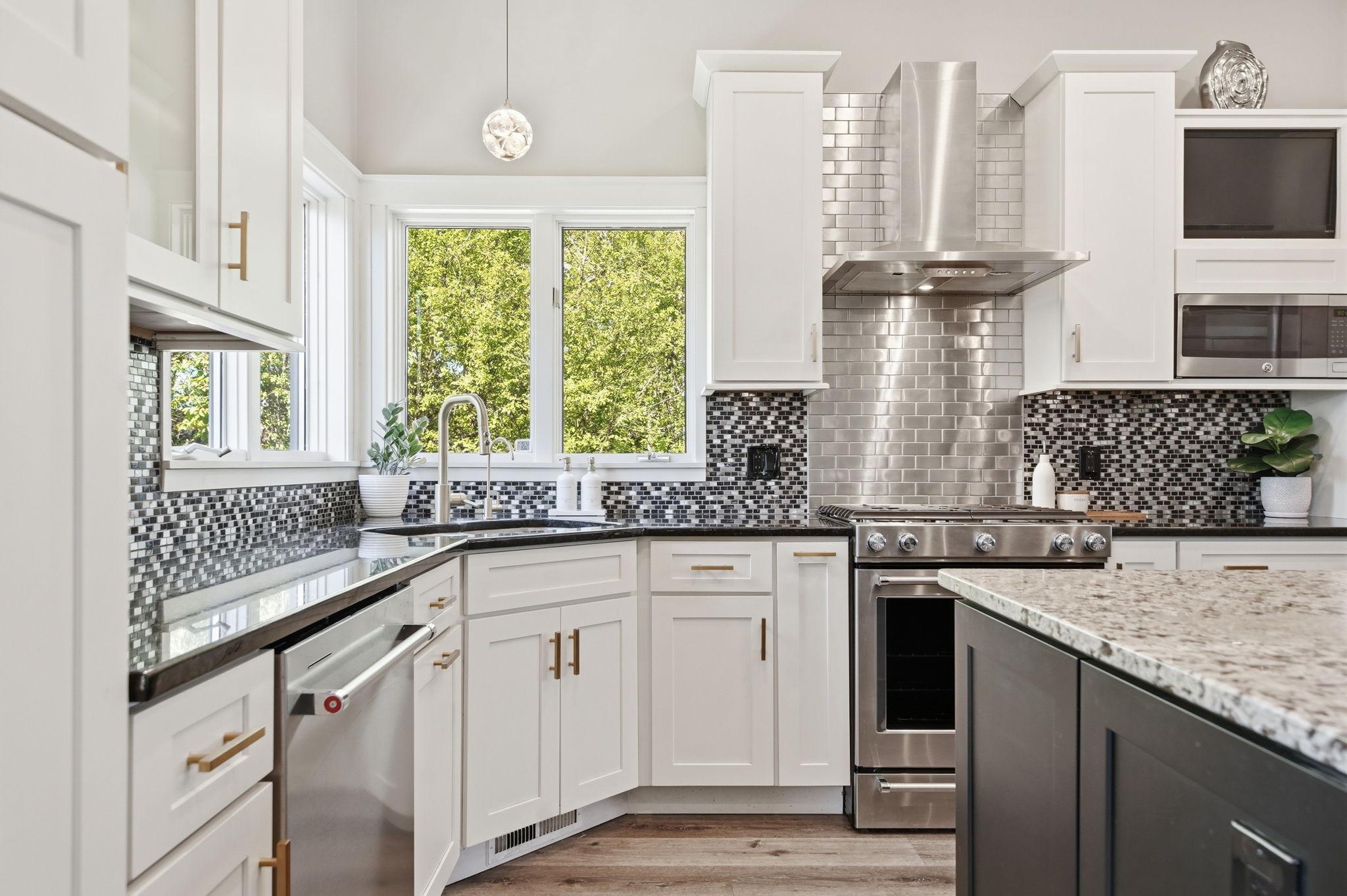 Granite countertops and custom tile backsplash