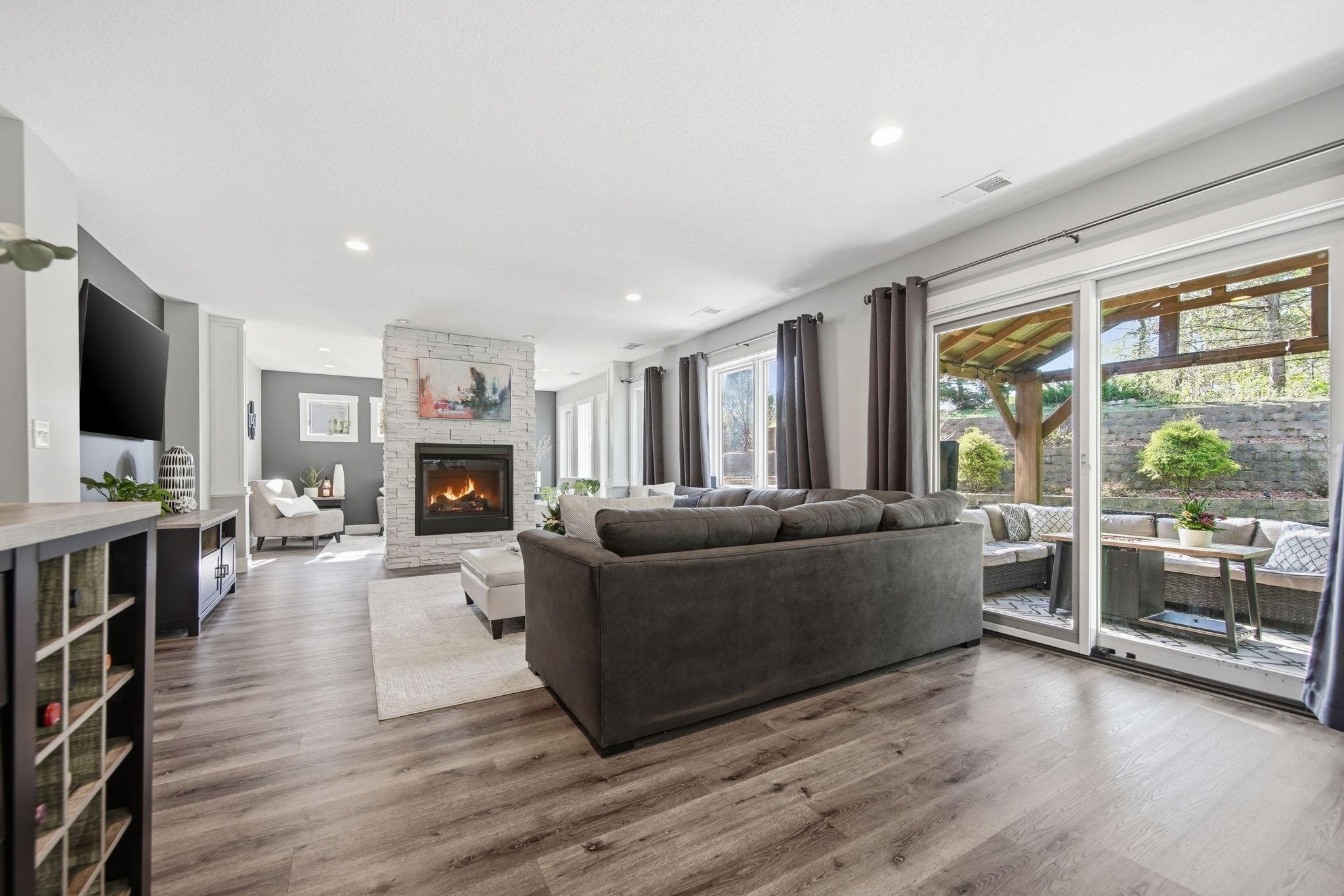 Indoor/outdoor entertaining through the slider where you'll find a custom outdoor living space and entertaining oasis!