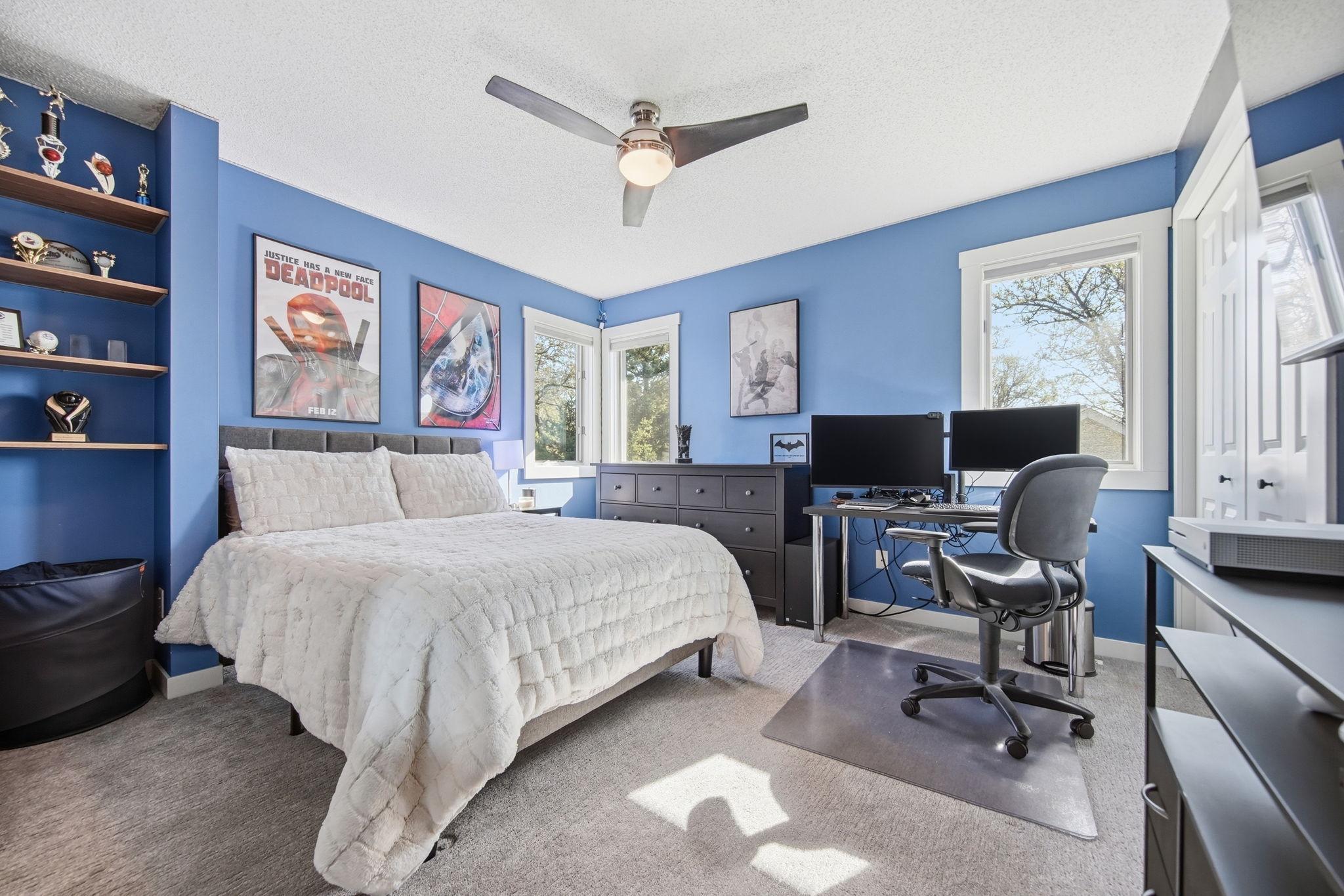 Upper-level second bedroom is sunny and spacious